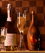 Load image into Gallery viewer, Prima Pave - Rose Brut - Alcohol Free Sparkling Wine with glass in a wintery light