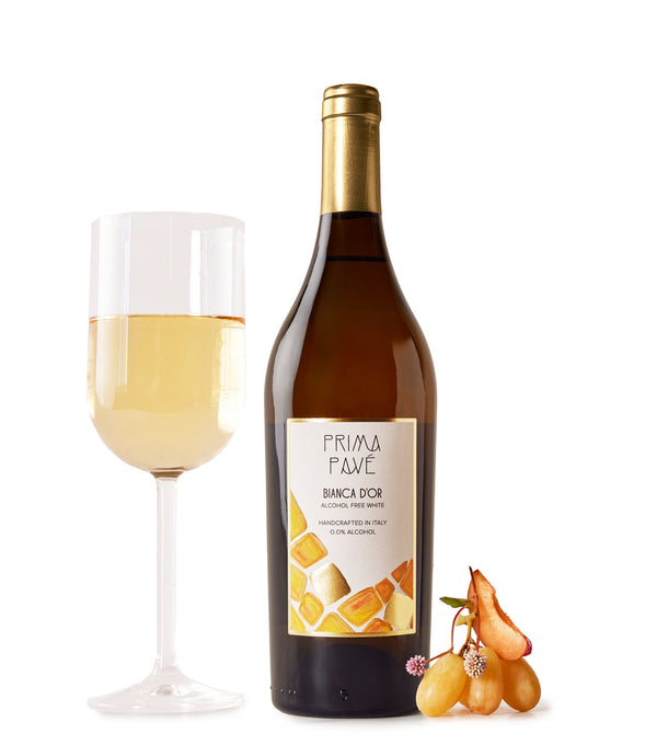 Prima Pave Bianca D'or Non-Alcoholic Still Wine with glass and fruit